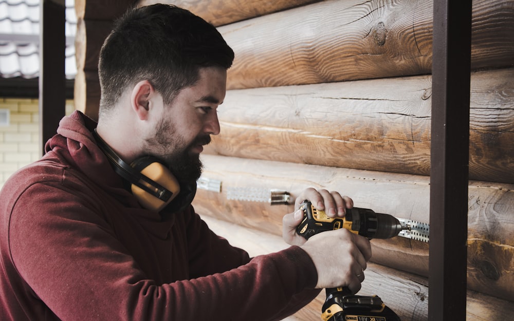 RuizBuilt crew member driving fasteners during a remodel
